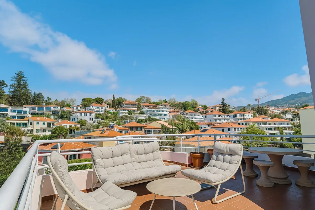 Loungers on the terrace above the bay