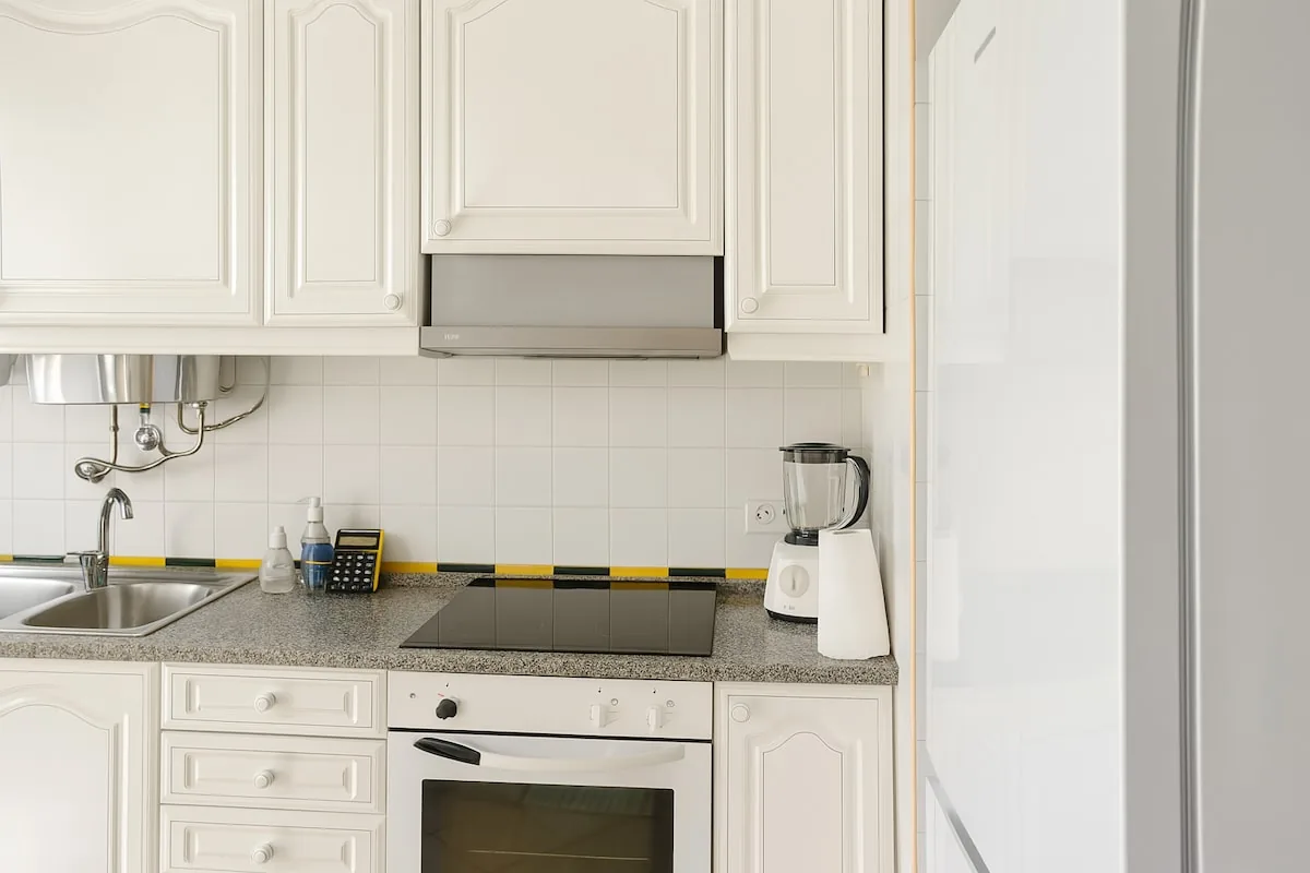 The kitchen, with oven, hob and full-size fridge